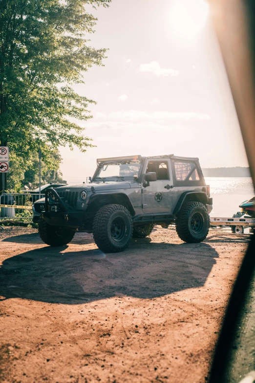 a jeep driving past a sign that says i have no friends