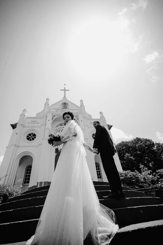 a woman that is standing in front of a church