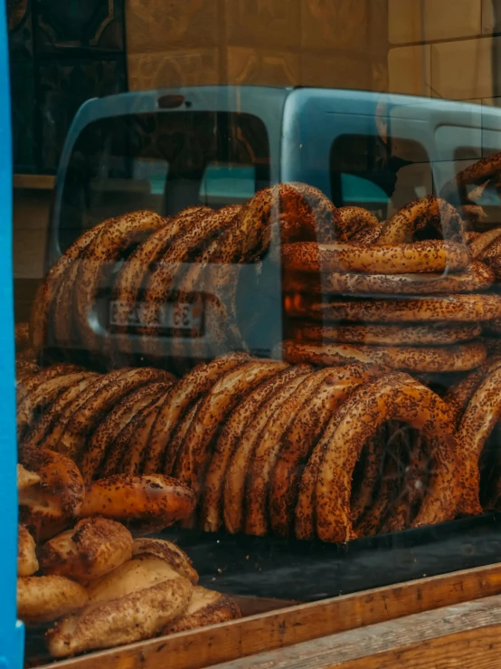 doughnuts and other baked goods in a store window