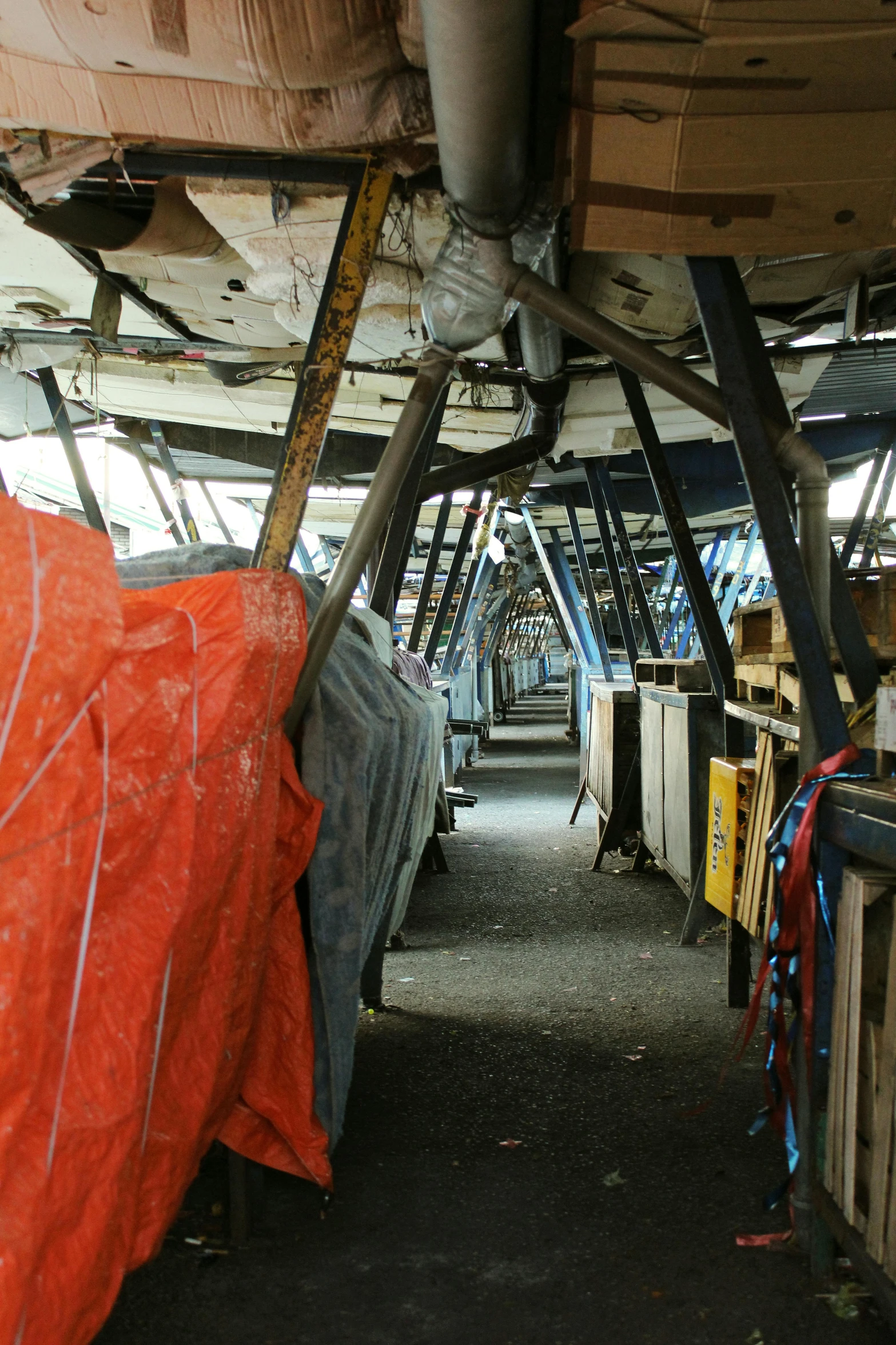 an abandoned industrial building, full of furniture and wires