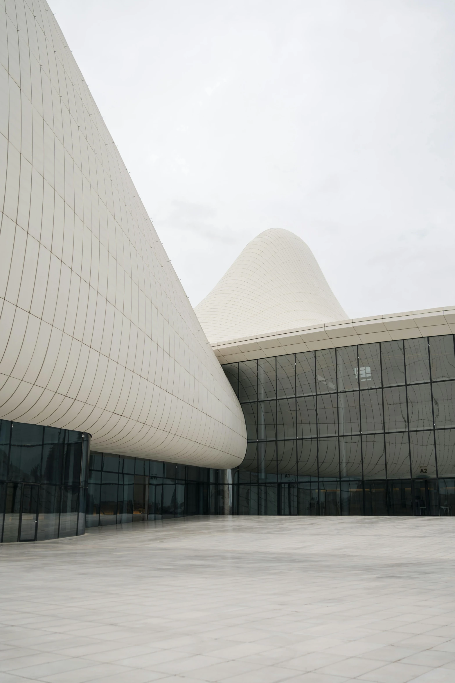 the exterior of a building that has a pointed roof