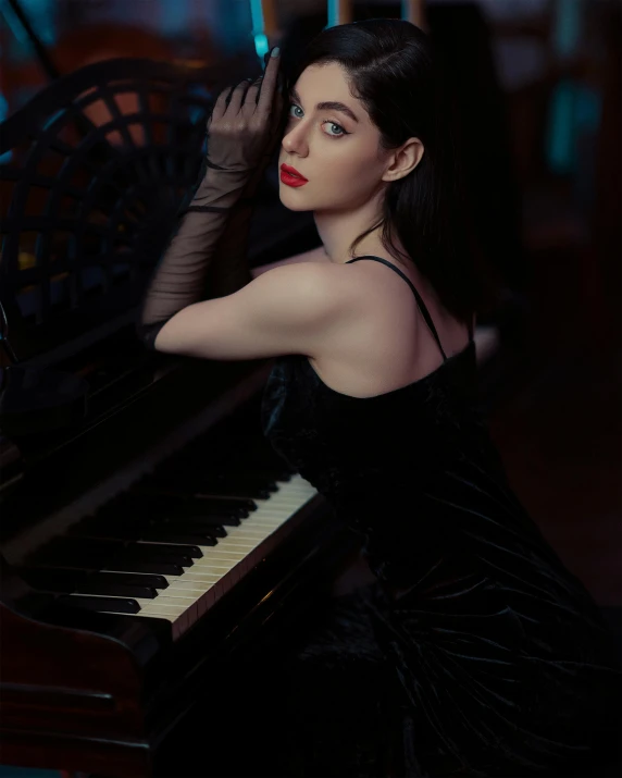 a woman leaning on a piano with her hand on her head