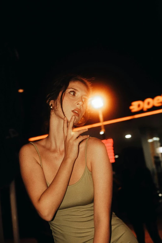 a woman posing for the camera at night