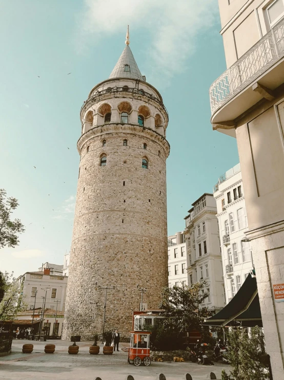 a large white brick building with a tower