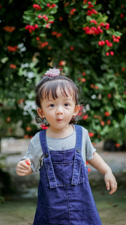 a little girl that is standing up