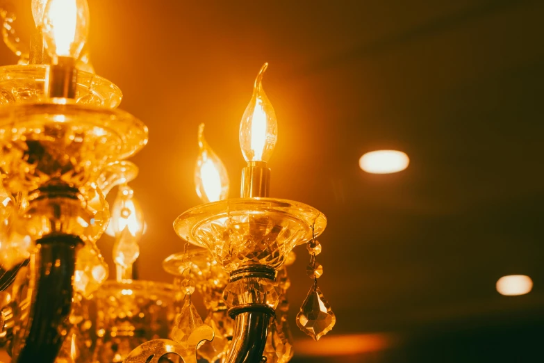 a lighted chandelier lit with many candle lights