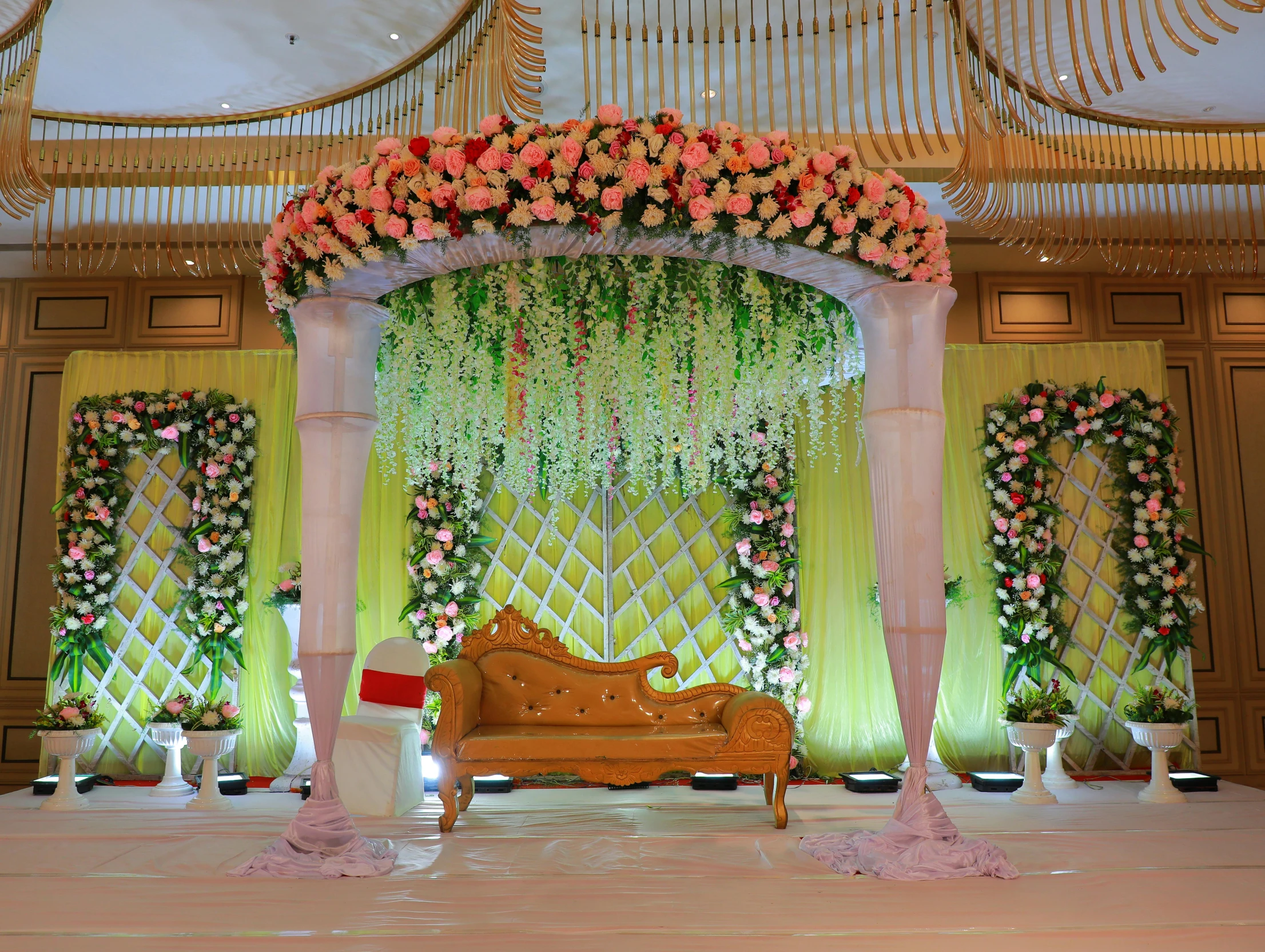 an elegant ceremony venue decorated in pink and gold