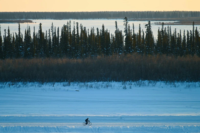 a person is walking across an icy lake