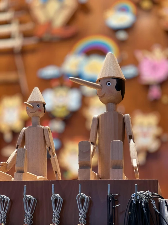 a small couple standing on top of a wooden surface