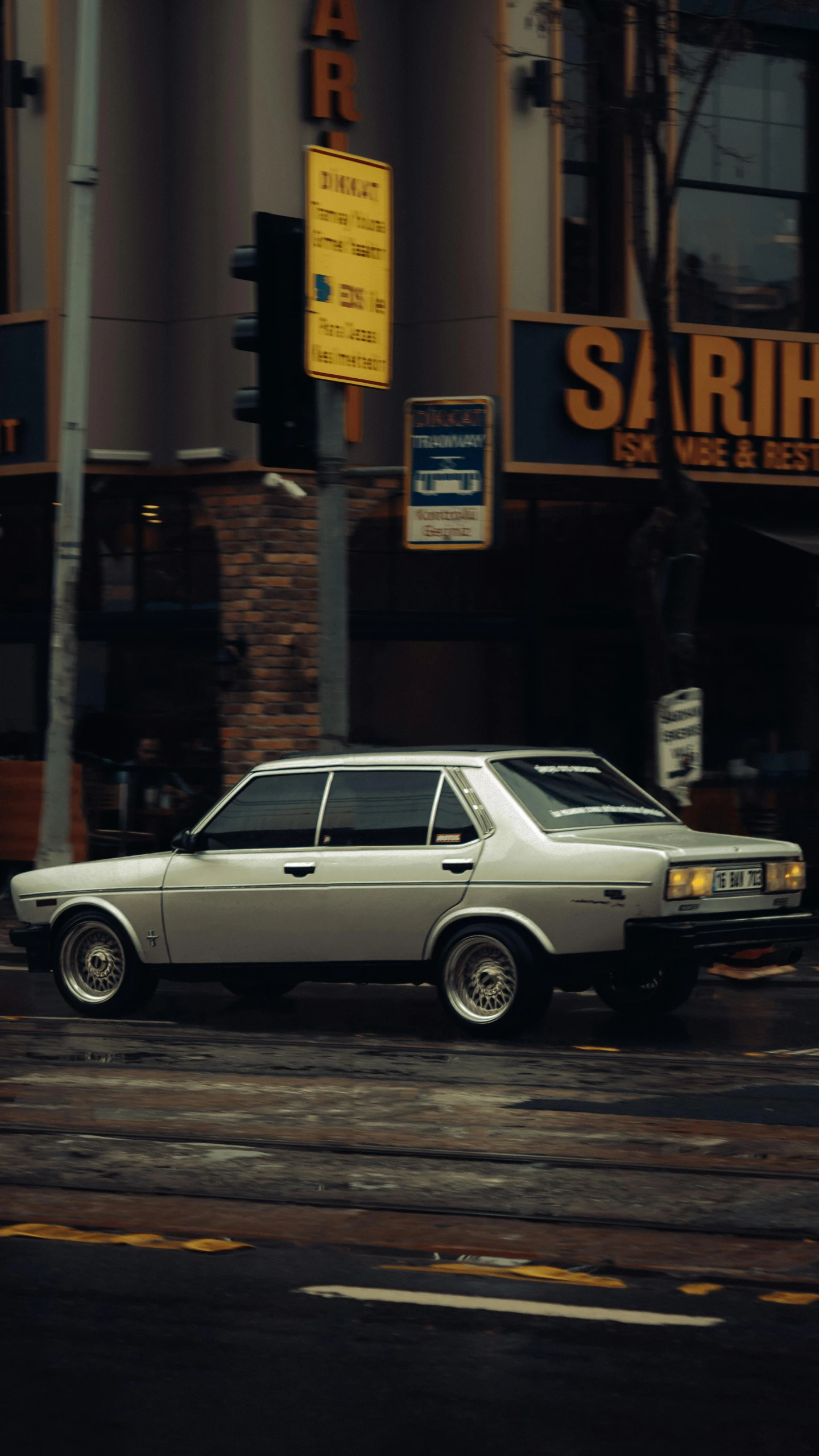 a car parked on the street with no passenger