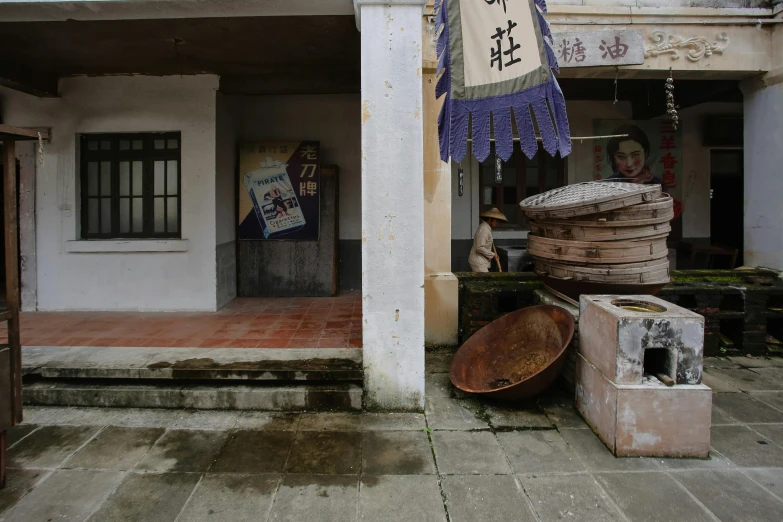 a bunch of junk sits outside an old building