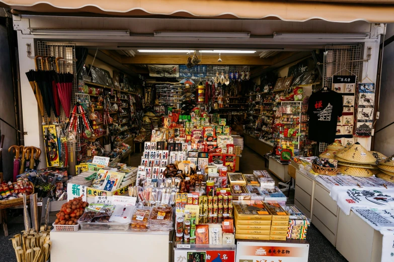 an assortment of chinese sweets and desserts for sale in a market