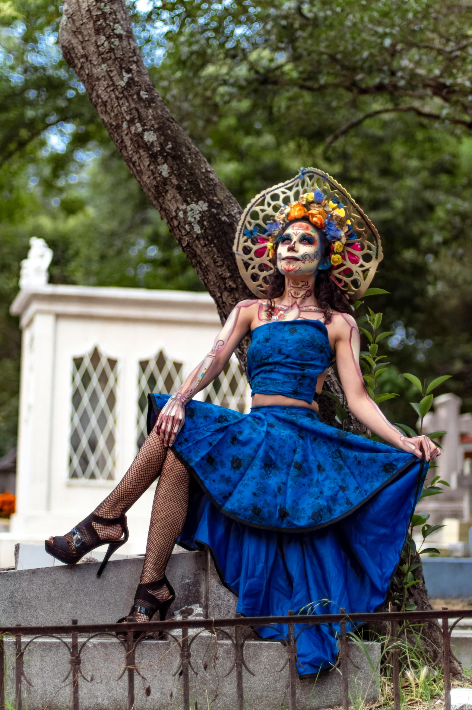 the woman is posing on a stone wall