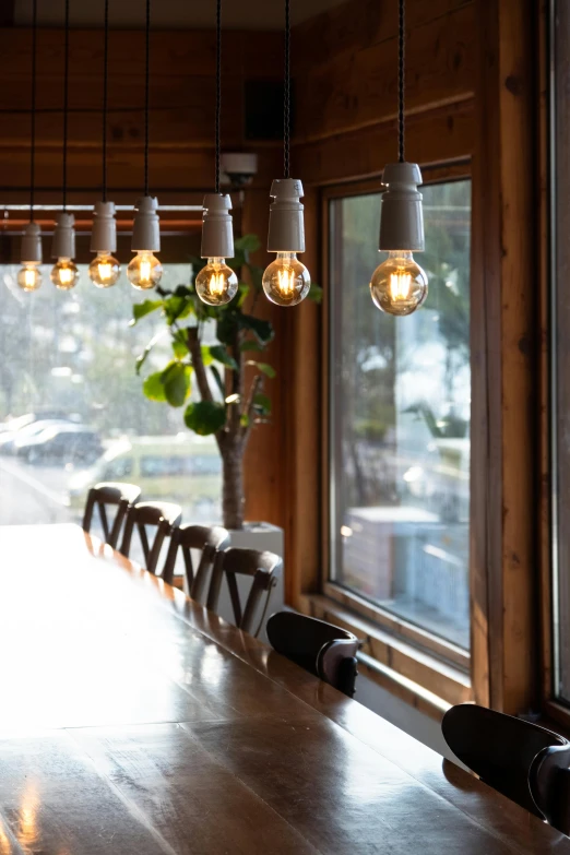 some light bulbs are hanging on a table