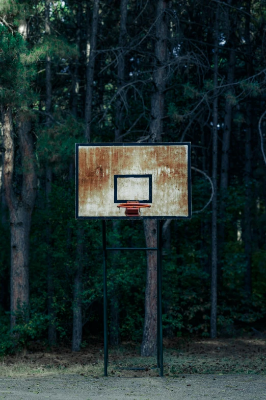 the backboard of a basketball goal is ed and old