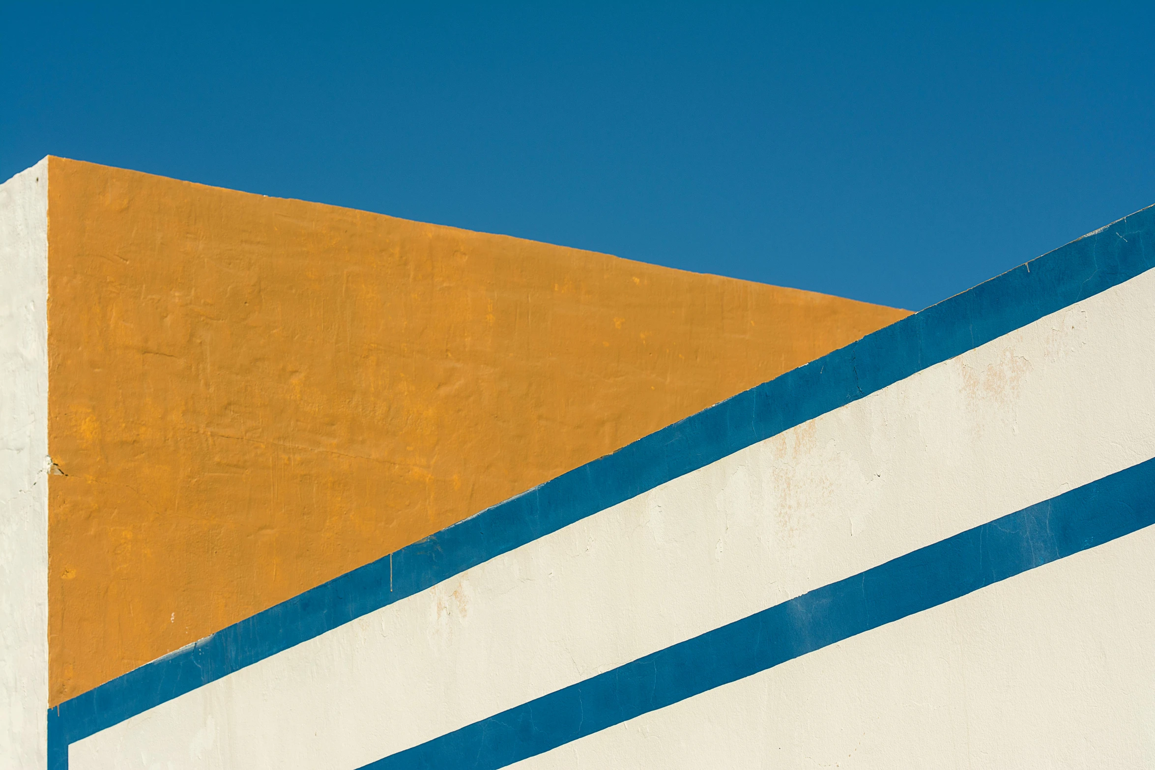 yellow and blue building and bright blue sky