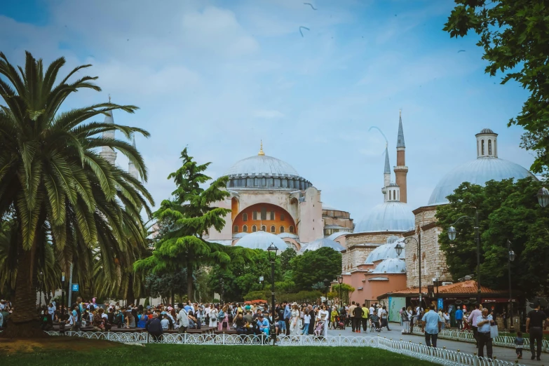 this is people walking on a walkway in front of a church