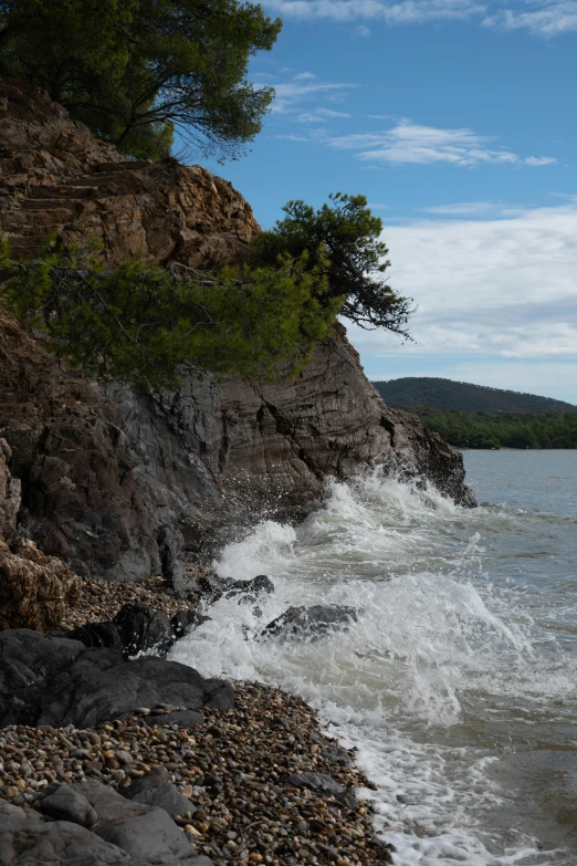 the rough beach is full of waves and rocks