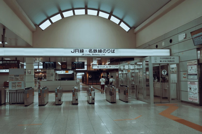 the inside of a train station with no passengers