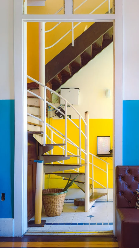 a living room with steps leading to a second story