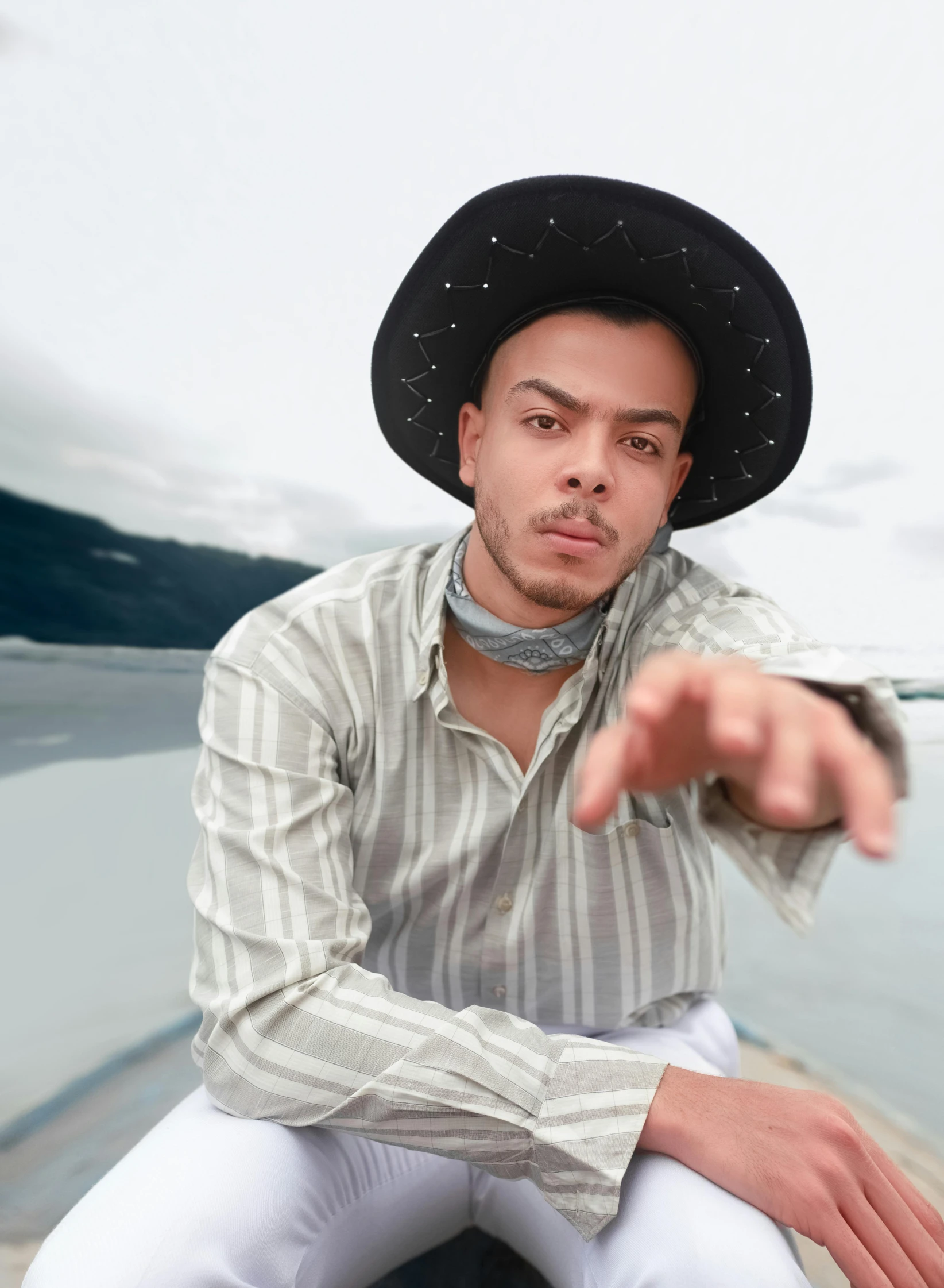 a man sitting on top of a rock