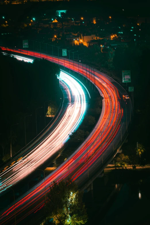 a night time po of a freeway and highway lights