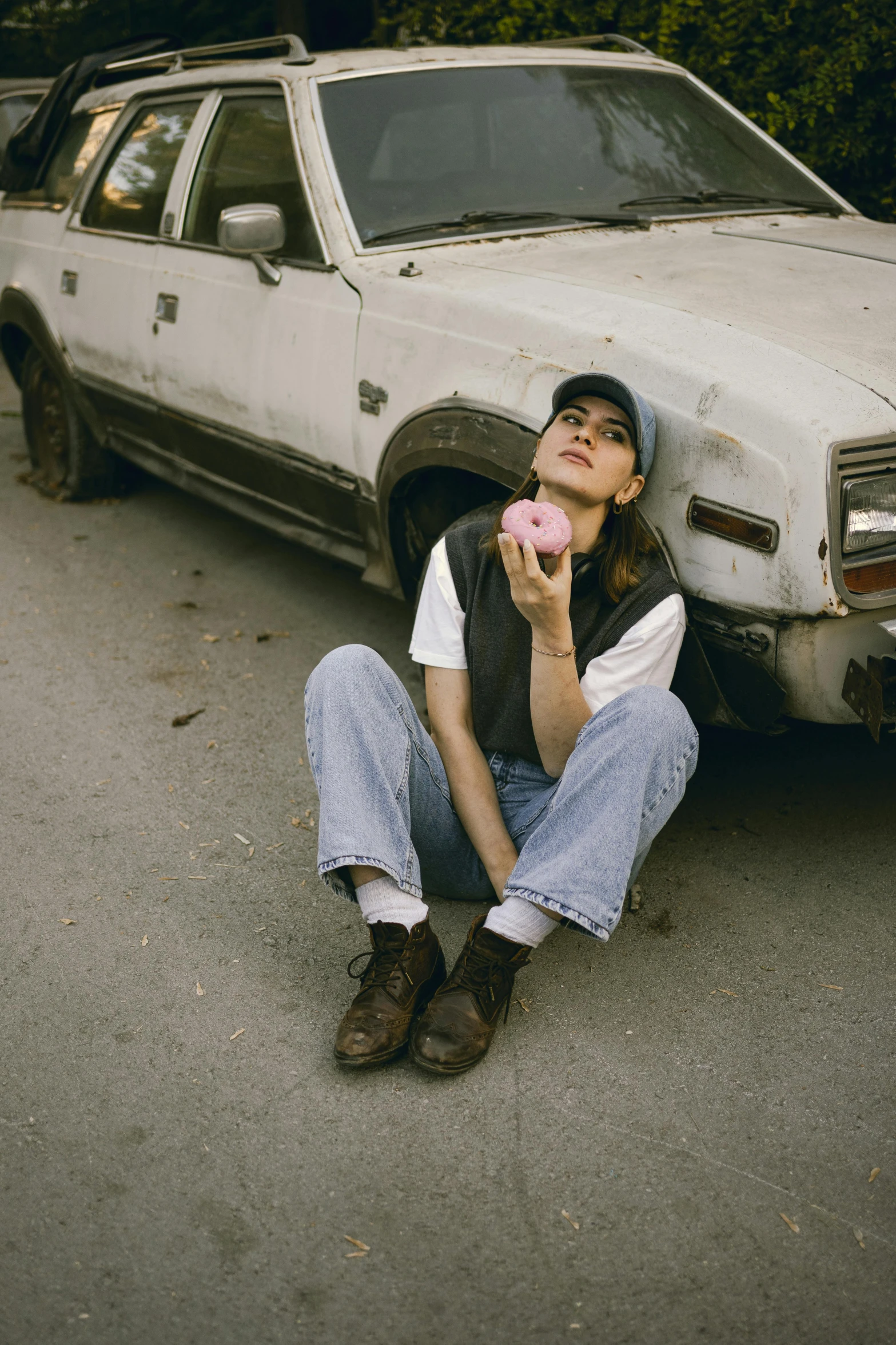 a man leaning up against the back of a white truck