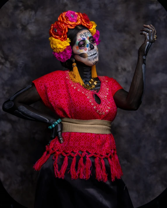 a woman with painted on her face wearing a red shirt