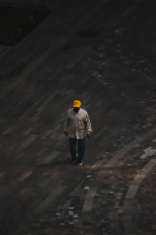 a man walking away in the dark with yellow goggles