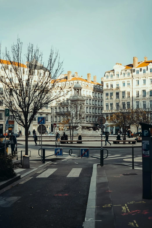 a street view with pedestrians walking by and buildings in the background