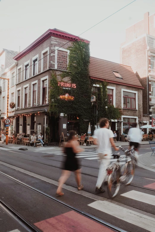 two people walk on the side of the street