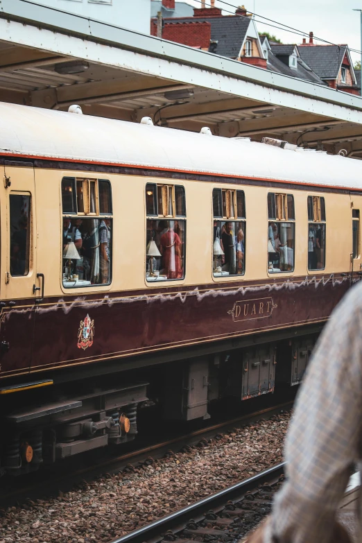 people who are looking out the windows on a train