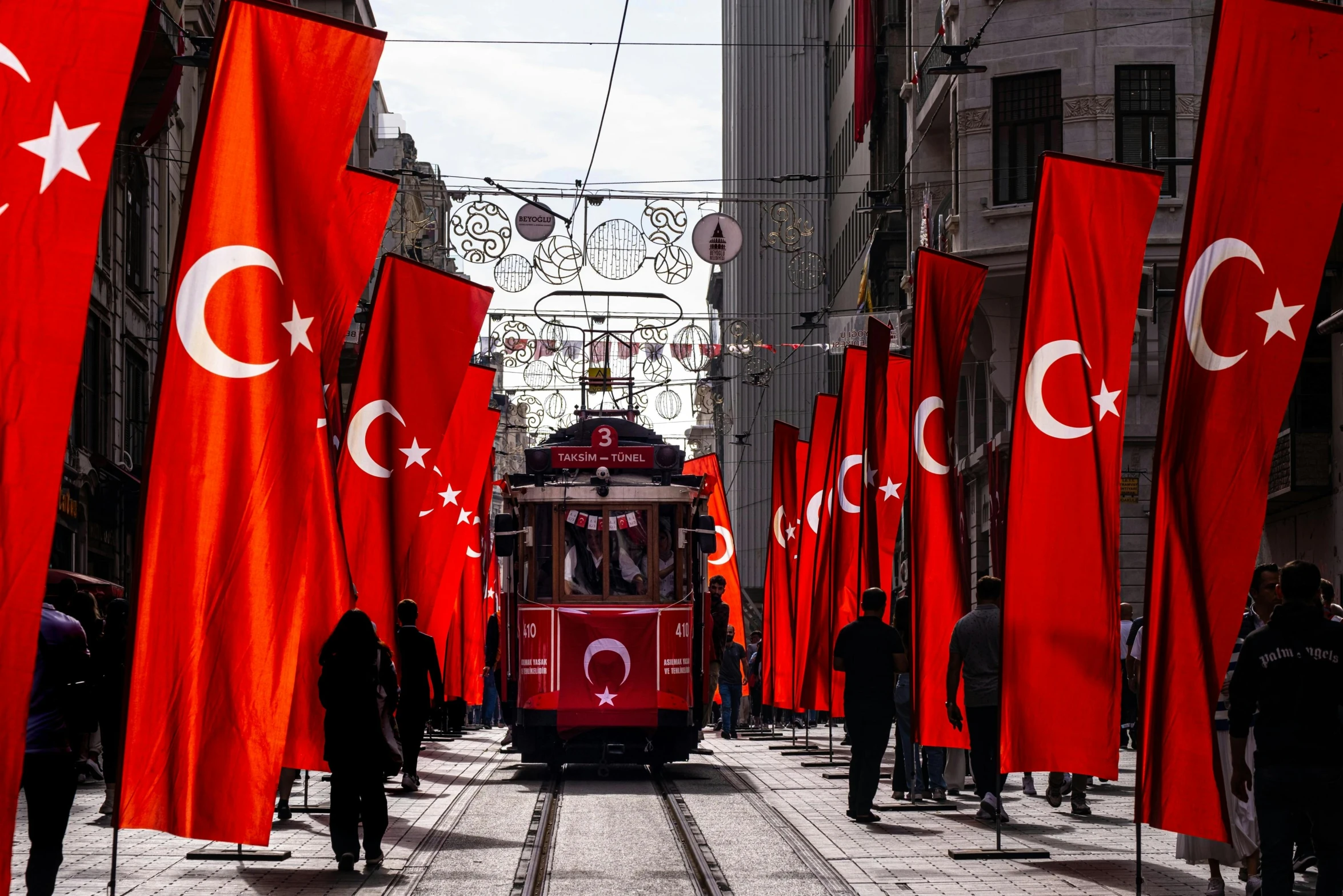 a street that has many red flags next to it