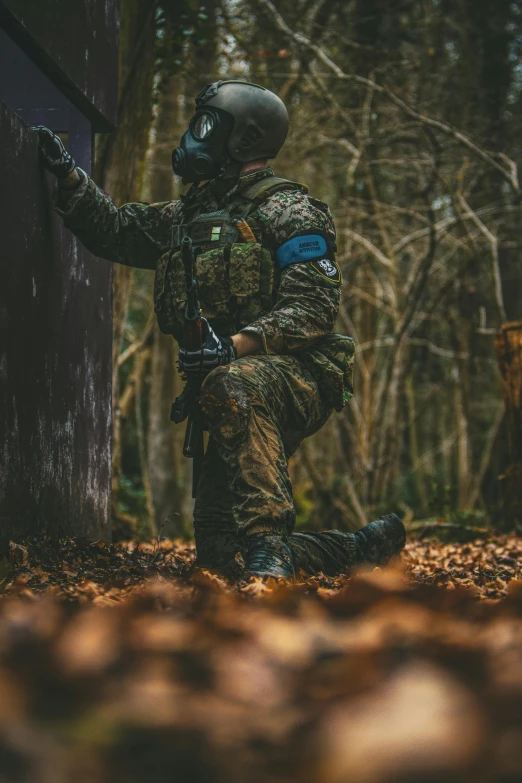 a soldier on the ground holding an item with a sword