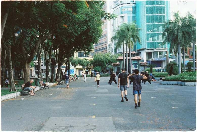 there are many people that are walking down the road