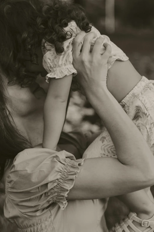 black and white po of woman holding child