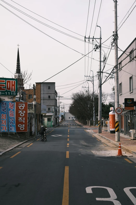 an empty street with signs on both sides