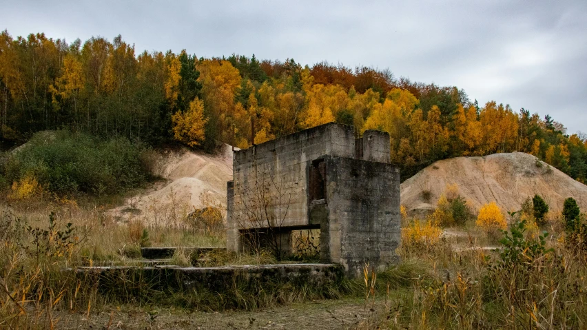 some building and some trees in a field