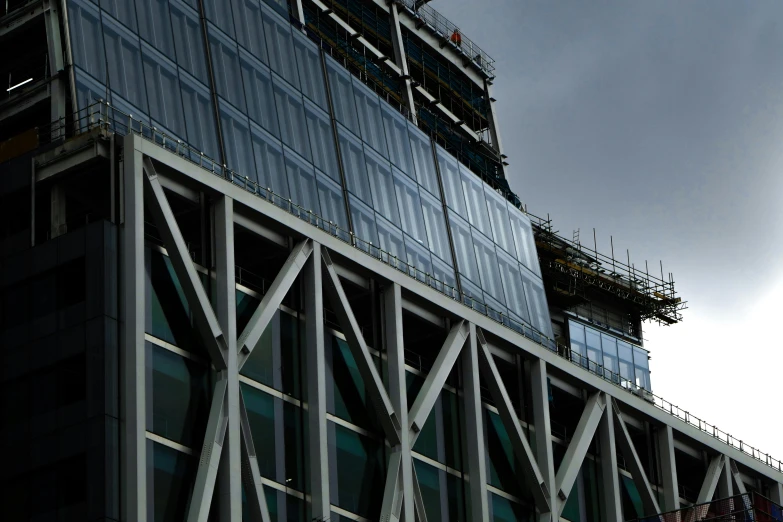 a bird is perched on the roof of a tall building