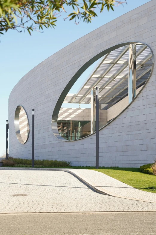 an image of the outside of a building with round mirrors on it