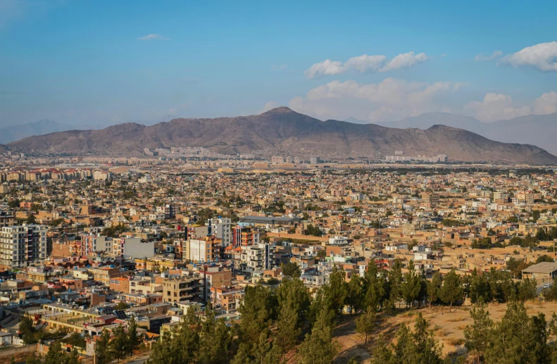 a panoramic s of the city of mexico, with mountains in the background