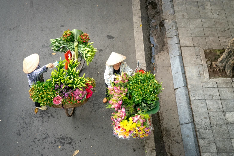 overhead s of farmers selling flower arrangements in baskets