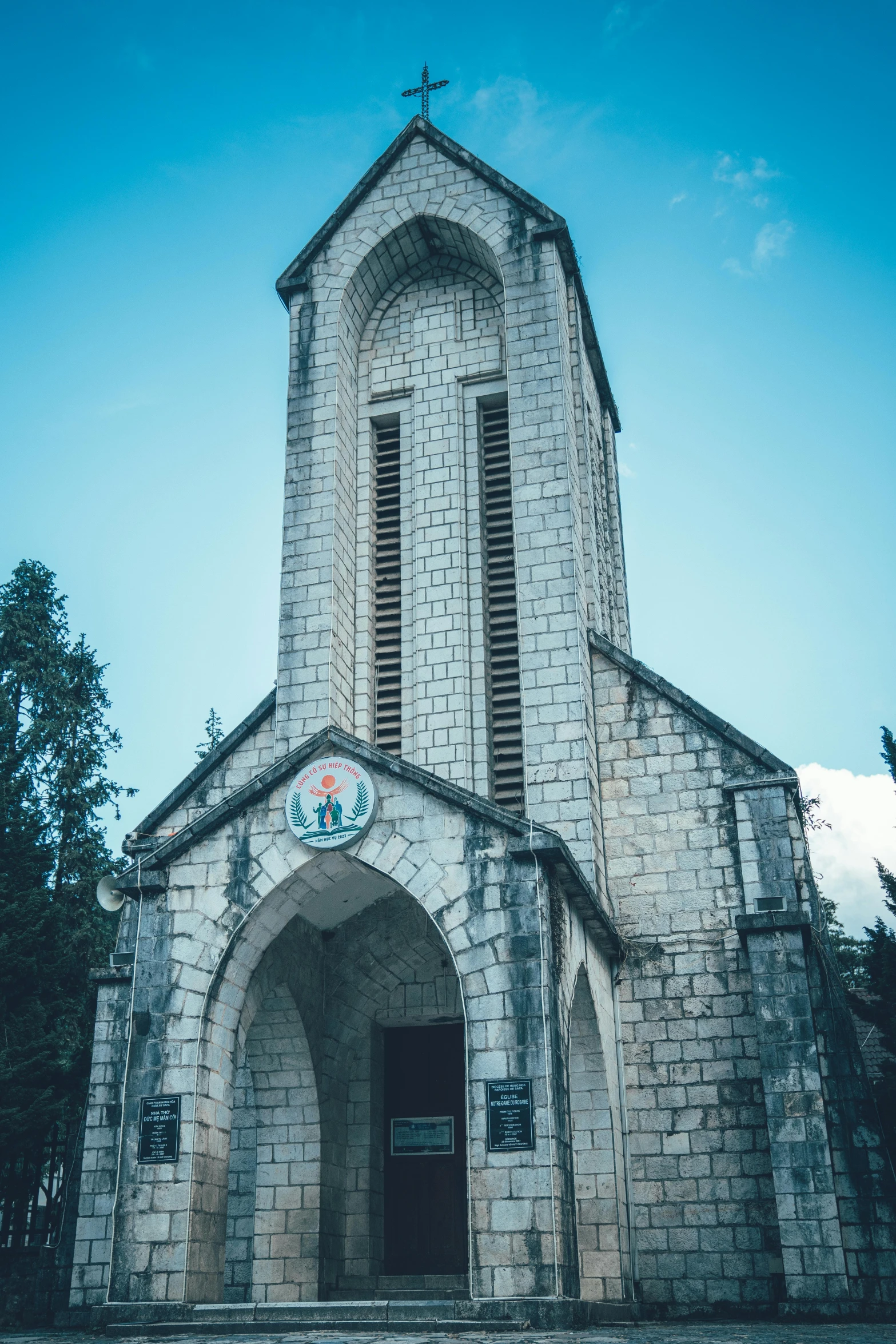 an old church with an outside staircase and door