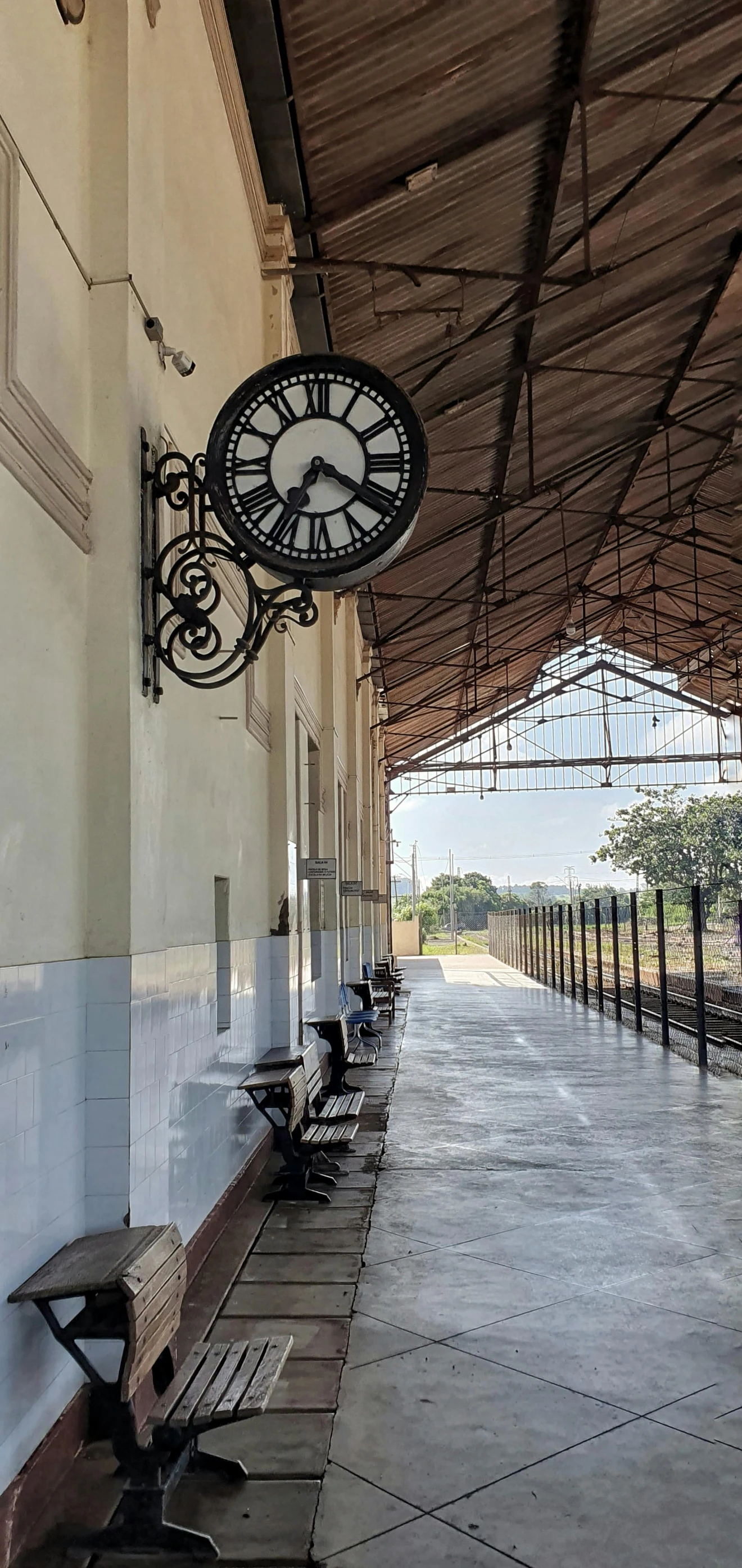 a long corridor that has benches along both sides of it