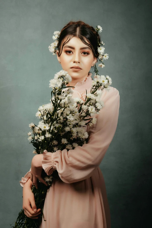 a girl with flowers wearing a long sleeved dress