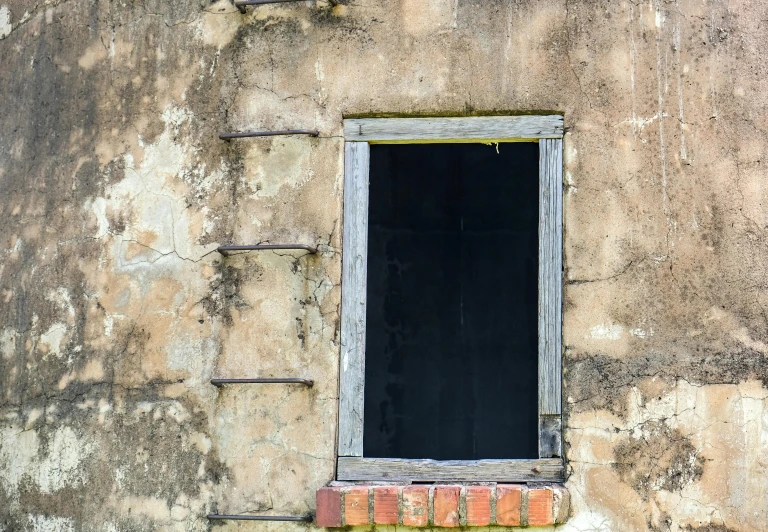 an old, run down building with a window