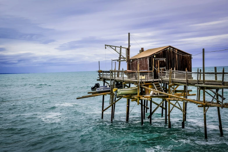 this is a pier made of boards with ropes