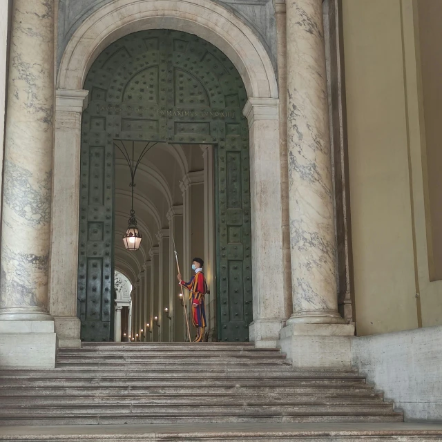 an archway leading to a room with staircases