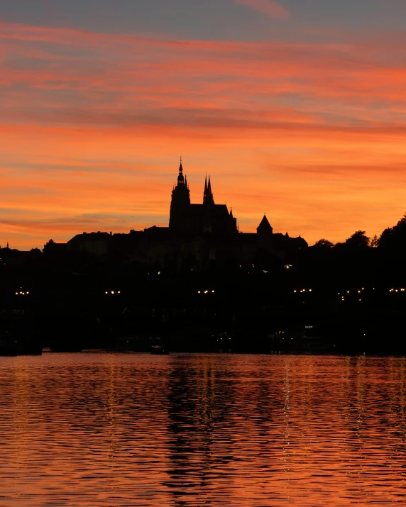 a view of a building in the background at sunset