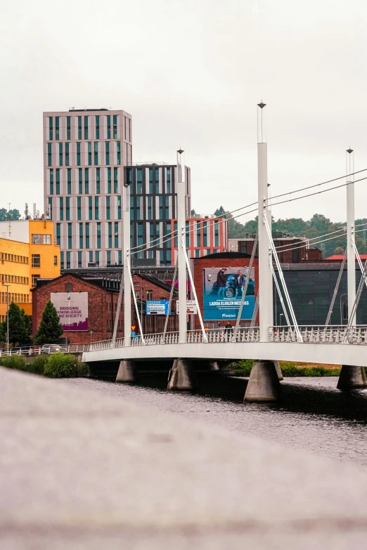 a white bridge crossing over a body of water